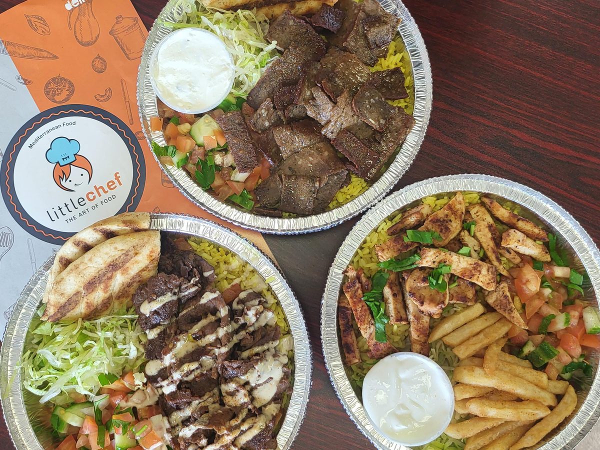 Chicken shawarma platter on rice with salad and pickled vegetables